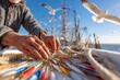 © Aleksandr - Elderly caucasian male preparing fishing tackle on boat with seagulls