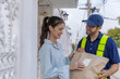 © kanpisut - Delivery express courier young man use giving boxes or Food to woman customer  at front home