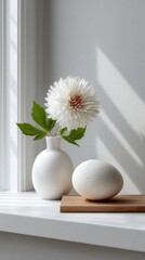 Poster - Clean and simple composition features a vase and an egg atop white plinths, enhanced by soft lighting and monochromatic tones