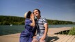 © Ruslan - Actors in vintage bathing suits portray a loving couple enjoying a sunny day by the lake, evoking a nostalgic atmosphere