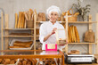 © JackF - Elderly woman baker offers to buy a fresh delicious sweet cake