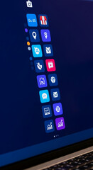 Poster - Laptop screen displays a vertical column of colorful app icons, representing digital business tools and online services, showcasing a modern interface and technological advancement