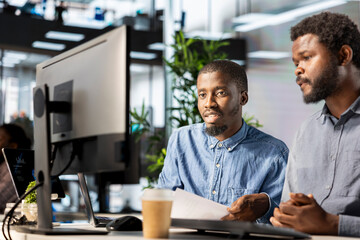 Poster - Entrepreneur meets with his team member to share insight on startup goals, focusing on collaboration, problem solving and innovative business strategies to support enterprise growth.