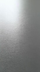 Poster - Abstract shimmering light reflecting off textured metal surface, creating a gradient from white to gray with horizontal pattern.