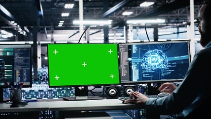 Poster - Server room technician using AI on green screen PC to review diagnostics. IT worker in data center analyzing performance data using artificial intelligence on chroma key computer, camera A