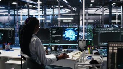 Poster - Data center system administrator working on neural network software development. African american woman in server room implementing machine learning technology using PC, camera A