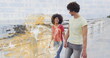 © vectorfusionart - Walking couple holding hands along seaside promenade, with white railing and breaking ocean waves
