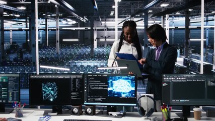 Poster - Team of data center engineers looking over paperwork and using deep learning algorithms to analyze datasets. Employees in multiethnic server farm using AI to recognize data patterns, camera A