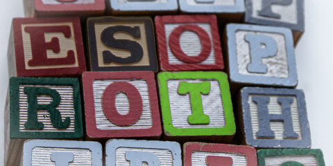 Aufkleber - ESOP and ROTH letters image background or design element. Key terms in finance related to employee stock ownership and retirement savings. company onboarding education presentation or slideshow banner