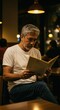 © Subu.STD - Man in cafe, reading menu
