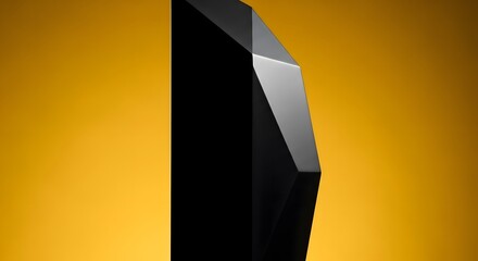 Leinwandbilder - Abstract geometric form displayed against a golden-yellow background. The black object reflects light with sharp angles and facets. The composition highlights contrast between dark and light.