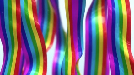 Poster - A dynamic flow of vibrant rainbow colors creating a fluid and organic textured surface, a creative abstract background concept.