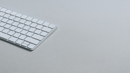 Poster - The Minimalist Interface: A sleek and modern keyboard sits on a reflective surface, representing the essence of streamlined technology and efficient communication.