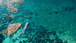 © Marcin - Red-Roof Boat, Coral Reef, and Rocky Outcrop – Aerial View of Mediterranean Coastline in Calabria, Italy