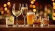 © Alba - The array of drinks elegantly displayed on a wooden table with blurred lights.