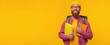 © Marta B - The cheerful student with colorful notebooks against a bright yellow backdrop