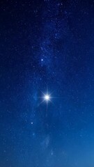 Wall Mural - deep blue night sky filled with thousands of stars and one extra bright, shining star with a four-po