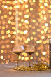 © Inna Vlasova - Sparkling Champagne Glasses with Bokeh Lights