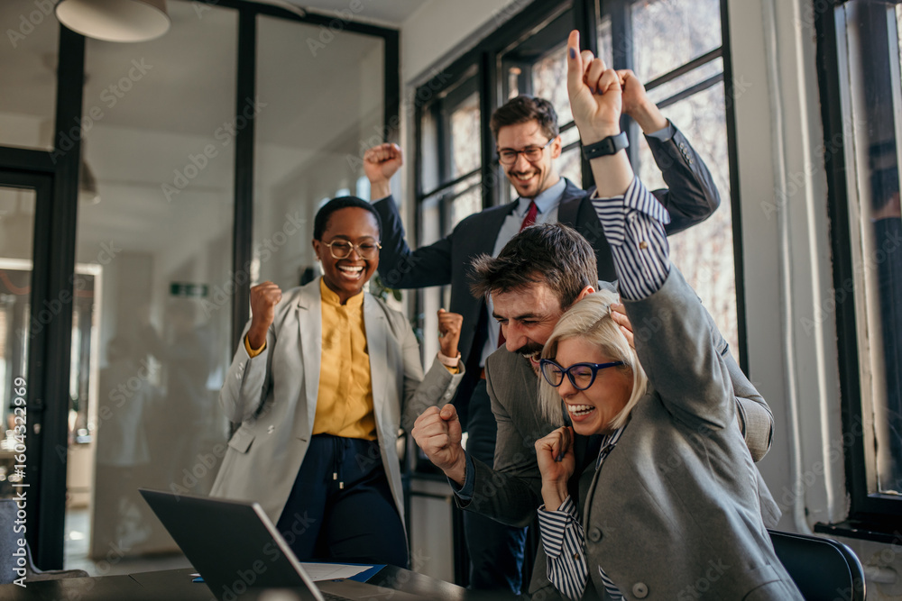 Excited business team celebrating success in the office Stock Photo ...
