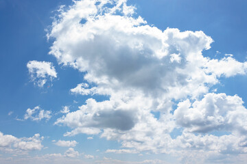 Wall Mural - white fluffy clouds on the azure blue sky. cumulus cloudscape in bright light in summer. weather background for vacation on a sunny day. cloudy atmosphere brings fresh air concept
