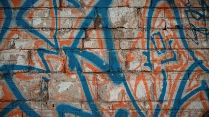 Poster - Brick Surface Adorned with Blue and Orange Paint Sprays