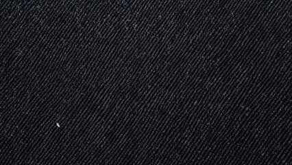 Poster - Detailed macro view of worn black jeans fabric highlighting diagonal weave.