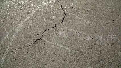 Poster - Detailed View of Aged Concrete with Pebbles Under Natural Lighting