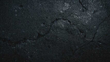 Poster - Detailed shot of a dark basalt stone surface with a mountainous texture