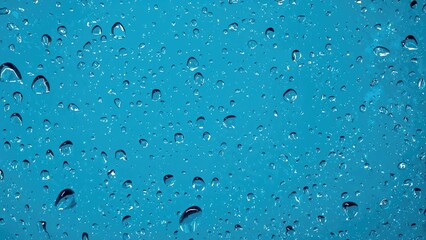 Poster - Blue glass adorned with falling water droplets