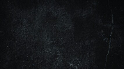 Poster - Dark concrete barrier featuring numerous fissures and gaps with a coarse surface