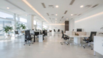 Poster - A modern open-plan workspace with a white color scheme and a softly blurred background.