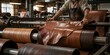 © ai tekno koncept - Tannery worker processing leather on an industrial roller machine