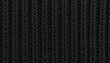 © Väike Studio - Black Rib Knit Wool Pattern. Textile Surface. Close up Texture. Background. Yarn.