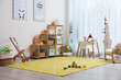 © New Africa - Stylish playroom with toys and furniture. Interior design