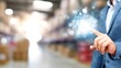 © Anan - Businessman Engaging in Warehouse Technology Visualization