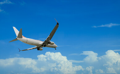 Wall Mural - airplane flying in beautiful blue sky with clouds