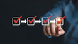 © Shamim - Achieve seamless progress with a hand completing a digital checklist, marking tasks with red checkmarks and arrows indicating forward momentum.