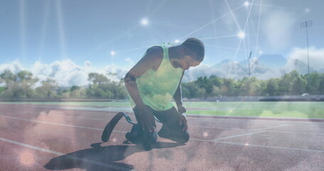 Poster - Kneeling teenage athlete adjusting prosthetic blade at start line, with light overlay