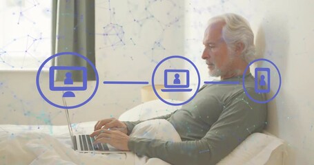 Poster - Mature man typing laptop on bed, monitor icon appearing and device icons showing network tech