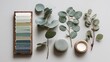 © RANO AKTER SANTA - Natural color palette swatches with eucalyptus branches and candle for organic design inspiration