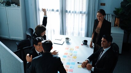 Poster - Top view of professional project manager present idea while diverse team putting hands together and clapping hand to celebrate successful strategy at meeting room. Show unity, teamwork. Directorate.