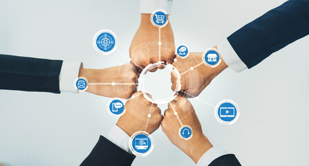 Poster - A dynamic scene showcasing business hands meeting in a circular manner, enhanced by digital icons that symbolize networking, innovation, and collaboration. A visual representation of teamwork. Amity