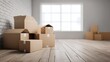 © Juan - Cardboard moving boxes stacked in empty white interior space with large windows and wood floor