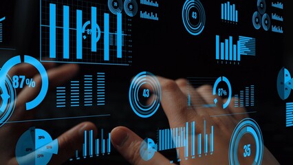 Fototapete - A modern and futuristic representation of data visualization with hands interacting on a touchscreen interface displaying various graphs and statistics in a dark setting. Xenic