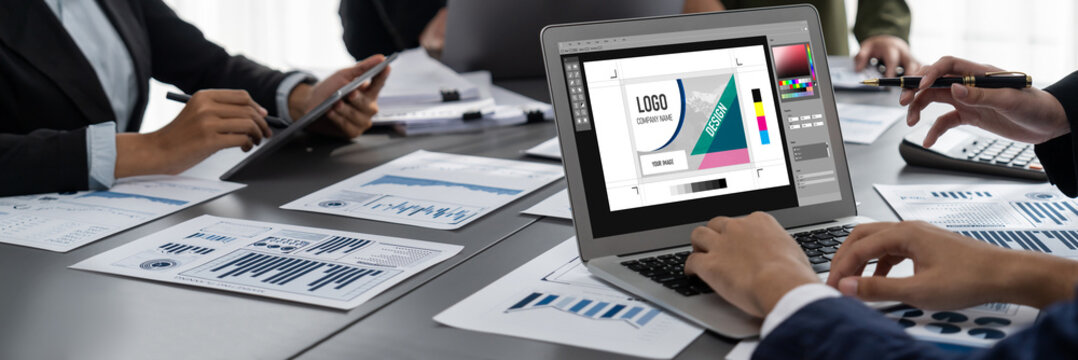 Graphic designer software for modern design of web page and commercial brisk ads showing on the computer screen
