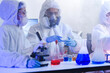© ultramansk - A team of scientists in hazmat suits works on a vaccine in a high-security biocontainment lab. Concept for pandemic response, virology, and medical research.