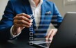 © Fahad - Businessman in a suit ticking a virtual checklist on a digital interface, managing tasks for project completion and success.