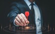 © Fahad - Businessman in a suit holding a red dart pointing towards a glowing virtual target. Concept of business goal, strategy, and success.
