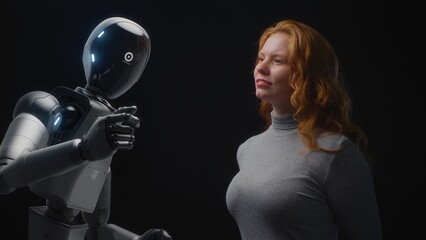 Fototapete - Futuristic Human-Machine Concept: Visualization of Young Woman Speaking with Advanced Humanoid Robot. People and Robots Working Together. Collaboration Between Humanity and Artificial Intelligence.