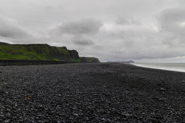 Wall Mural - Overcast day over the black sand beach in Vik, Iceland.